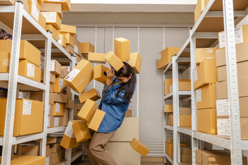 Small business, partnership, warehouse store, inventory management, accident at work, boxes falling from shelf stock, health insurance, worker facing injury, business insurance and safety management