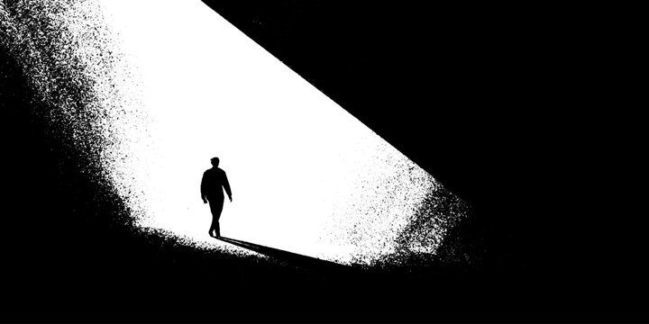 Silhouette of person walking in stark black and white abstract light and shadow