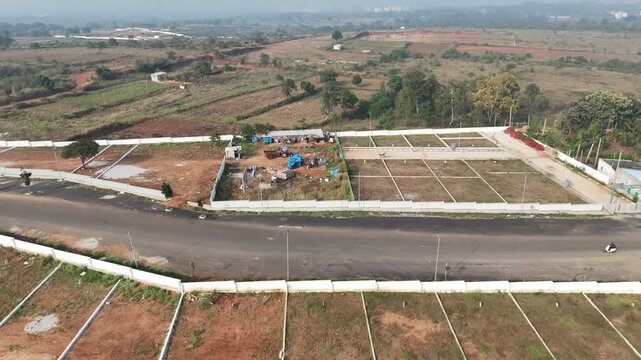 Aerial View of Emerging Development Area Near Bangalore &ndash; Planned Residential Plots, New Road Infrastructure, and Urban Expansion Toward Hosur and Devanahalli Corridors