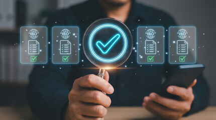Businessman holding magnifying glass and smartphone examining glowing checkmark and ISO certificate icons conveying confidence and quality assurance