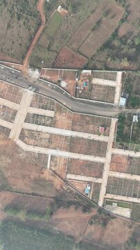 Aerial View of Emerging Development Area Near Bangalore &ndash; Planned Residential Plots, New Road Infrastructure, and Urban Expansion Toward Hosur and Devanahalli Corridors