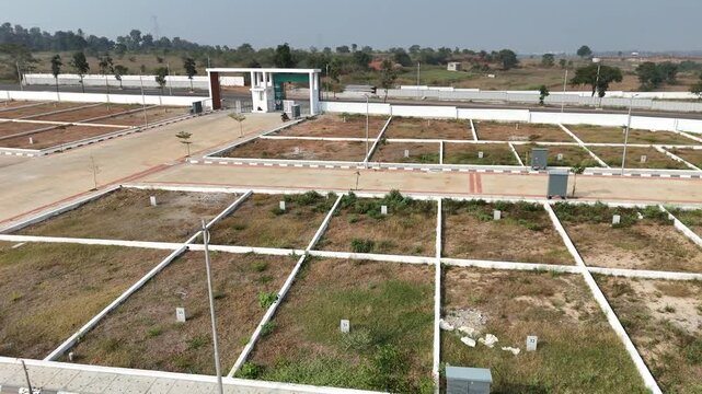 Aerial View of Emerging Development Area Near Bangalore &ndash; Planned Residential Plots, New Road Infrastructure, and Urban Expansion Toward Hosur and Devanahalli Corridors