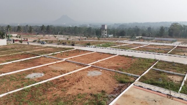 Aerial View of Emerging Development Area Near Bangalore &ndash; Planned Residential Plots, New Road Infrastructure, and Urban Expansion Toward Hosur and Devanahalli Corridors