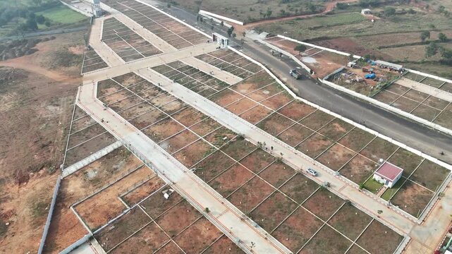 Aerial View of Emerging Development Area Near Bangalore &ndash; Planned Residential Plots, New Road Infrastructure, and Urban Expansion Toward Hosur and Devanahalli Corridors
