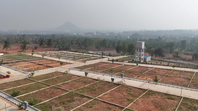 Aerial View of Emerging Development Area Near Bangalore &ndash; Planned Residential Plots, New Road Infrastructure, and Urban Expansion Toward Hosur and Devanahalli Corridors