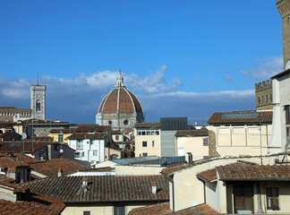 panoramic view of florence rooftops with the dome and the bell tower of the duomo in the city
