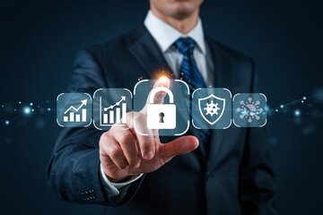 Professional businessman touching a glowing digital padlock icon representing cybersecurity data protection and secure financial growth strategy