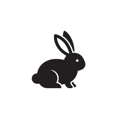 Obraz premium Black Rabbit Sitting on White Background