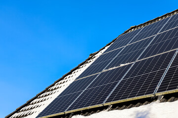 Rooftop solar panels generating clean energy in winter