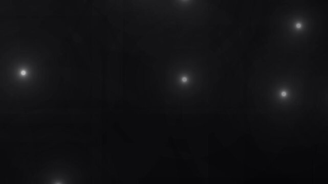 Paparazzi flashes of cameras on a black background. Camera flashes light animation overlay. Cinematic random bright blinking lights. The concept of popularity- Flashing lens flares seamless looping.