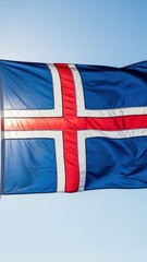 Iceland Flag Waving Against Nordic Sky