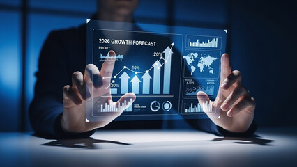 Businessman analyzing 2026 growth forecast on futuristic digital screen
