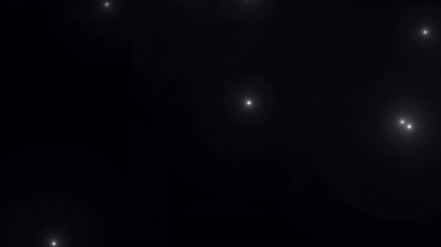 Paparazzi flashes of cameras on a black background. Camera flashes light animation overlay. Cinematic random bright blinking lights. The concept of popularity- Flashing lens flares seamless looping.