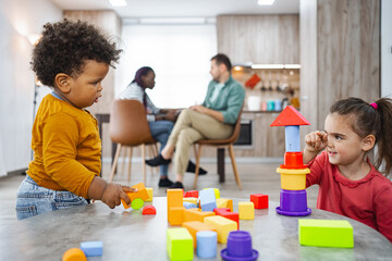 Multi racial family enjoying creative playtime at home
