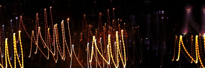 Abstract linear composition. Photography, selective focus, long exposure, dynamic movement. Light lines. Texture. Background. Cover. Wrapper. Wallpaper.