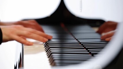 Skillful hands play melodic piano piece with expressive movement