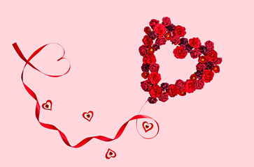 Romantic Heart-Shaped Red Rose Wreath with Ribbon on Pink Background for Valentine's Day