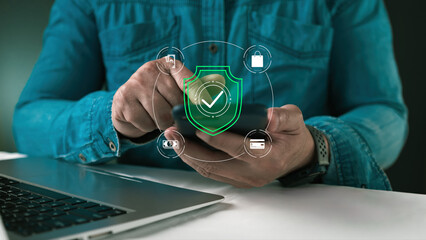 Businessman utilizing digital devices with futuristic fintech interface. Concept includes financial technology data analysis, cyber security protection, and secure online banking payment.