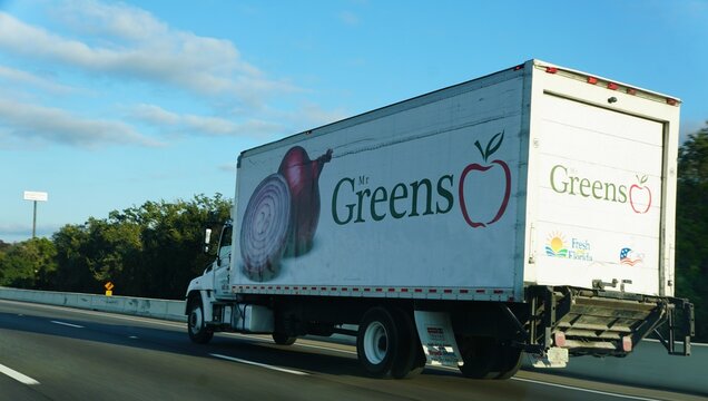 Sarasota County, Florida, U.S - Jan 4, 2026 - Mr Greens delivery truck showcases fresh produce branding with affiliations to Florida agriculture and culinary federation