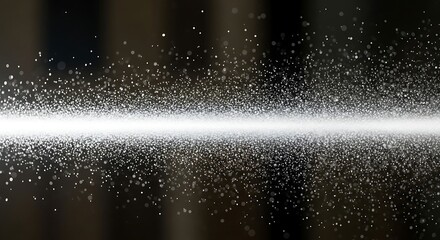 A bright horizontal beam of light illuminating countless tiny sparkling particles in a dark environment.