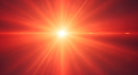 Obraz premium A bright, intense red and orange light burst with prominent lens flare and radiating rays.