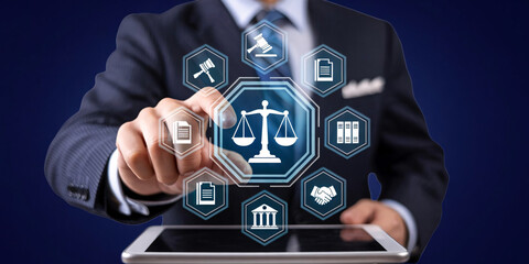 Businessman interacting with digital law and justice icons on tablet