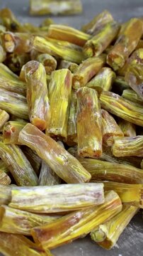 Close-up view of traditional Turkish fitil lokum with pistachio filling. Detailed texture of handcrafted Turkish delight dessert. Ideal for concepts such as traditional sweets, confectionery, Turkish 