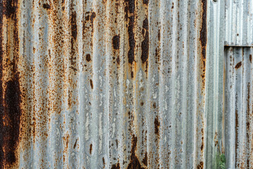 Industrial rusty background old grunge rusty zinc wall for textured background old rusty galvanized rust and scratched steel texture corrugated iron siding vintage background