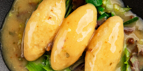 quenelle fish mince sauce mushroom French cuisine main course tasty snack fresh delicious gourmet food background on the table rustic food top view copy space pescetarian diet