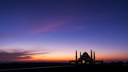 Majestic mosque silhouette at sunset with a dramatic purple and orange gradient sky