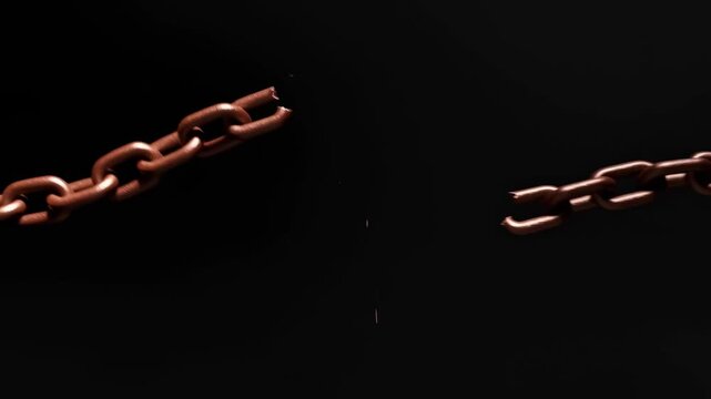 Rusty chain breaking under tension over black background in slow motion