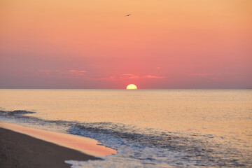 Sunrise Over Calm Ocean