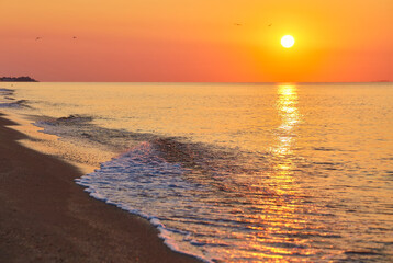 Sunrise Over Sea with Foamy Waves