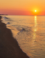 Sunrise Over Sea with Foamy Waves