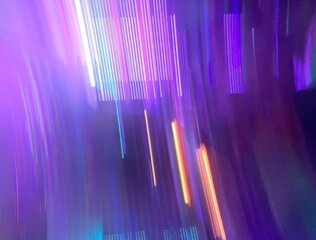 Abstract Purple Light Trails Moving Through a Dark Space with Vibrant Colors and Dynamic Motion