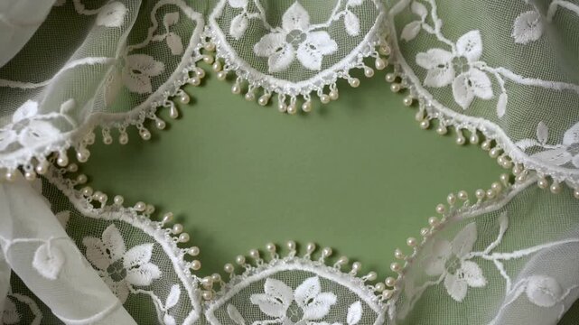 Elegant White Lace with Pearl Embellishments and Soft Green Background Elegant Overlay for Design and Decoration