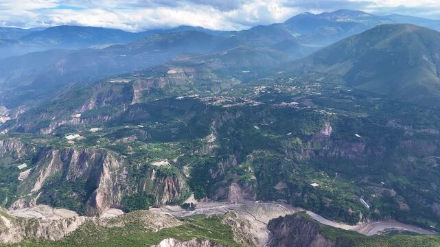 Aerial drone footage of a mountain ravine near the Pucar&aacute; de Rumicucho archaeological site in Ecuador. Natural Andean landscape with rugged terrain and vegetation, ideal for nature documentaries, trav