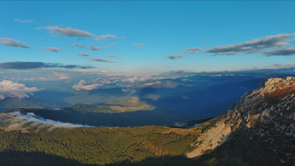 Aerial view of amazing rocky mountains at sunset