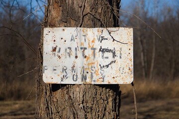 Weathered signage at an abandoned park