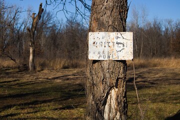 Weathered signage at an abandoned park