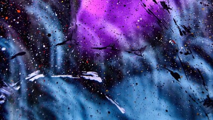 A vibrant abstract illustration of splattered paint and ink on a canvas, viewed from above in a studio environment