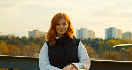 Young mother enjoying a peaceful day in the park with her stroller