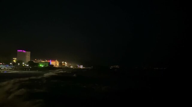 View of the night sea with waves. Golden Sands, Bulgaria. 4k