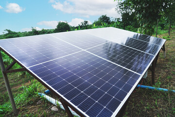 Grey black solar cell panel stands in agriculture farm for electric generating at Thailand.