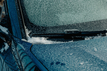 Frozen car window and door seal in winter