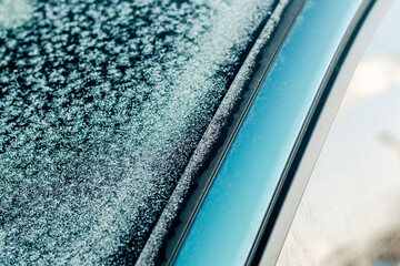 Frozen car window and door seal in winter