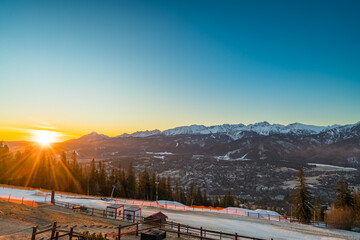 Tatry mountains at sunrise seen from Gubalowka hill in Zakopane. Poland