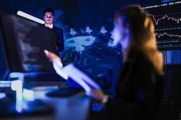 Cyber security team analyzing financial market protection. Expert presenting crypto trading safety strategy with digital shield graphic on screen at night.