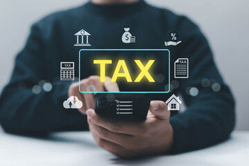 Businessman using smartphone with virtual tax interface digital icons, online tax management concept, business finance, accounting system, financial planning, government taxation, fintech technology