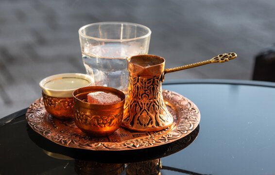 Traditional Bosnian coffee served in copper cezve with sugar delight. Sarajevo.